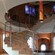 A spiral staircase in a museum with brick walls